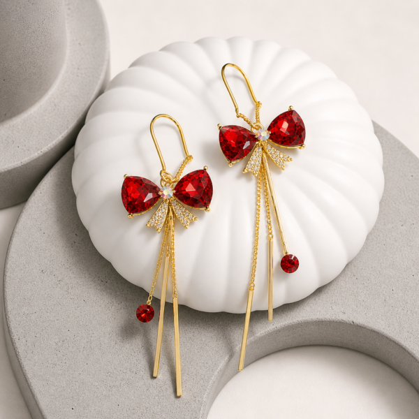scarlet bow sui dhaga earrings gold red stone close up