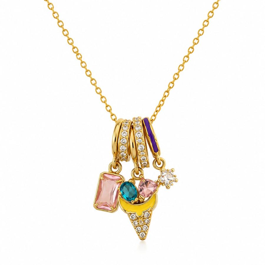 Extreme macro detail of the gold-plated ice cream cone charm with yellow enamel and pavé-set cubic zirconia, alongside other colourful charms – House of Ruhira