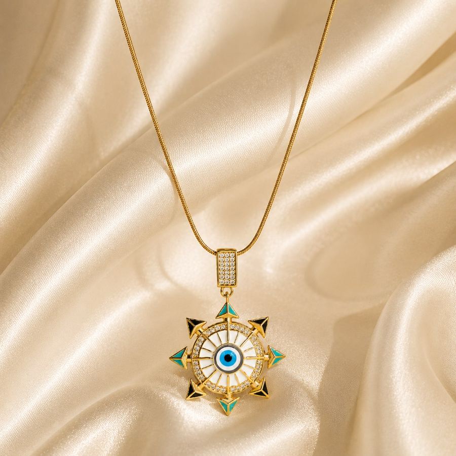Extreme macro detail of the central blue evil eye and surrounding clear CZ stones on the gold enamel pendant – House of Ruhira