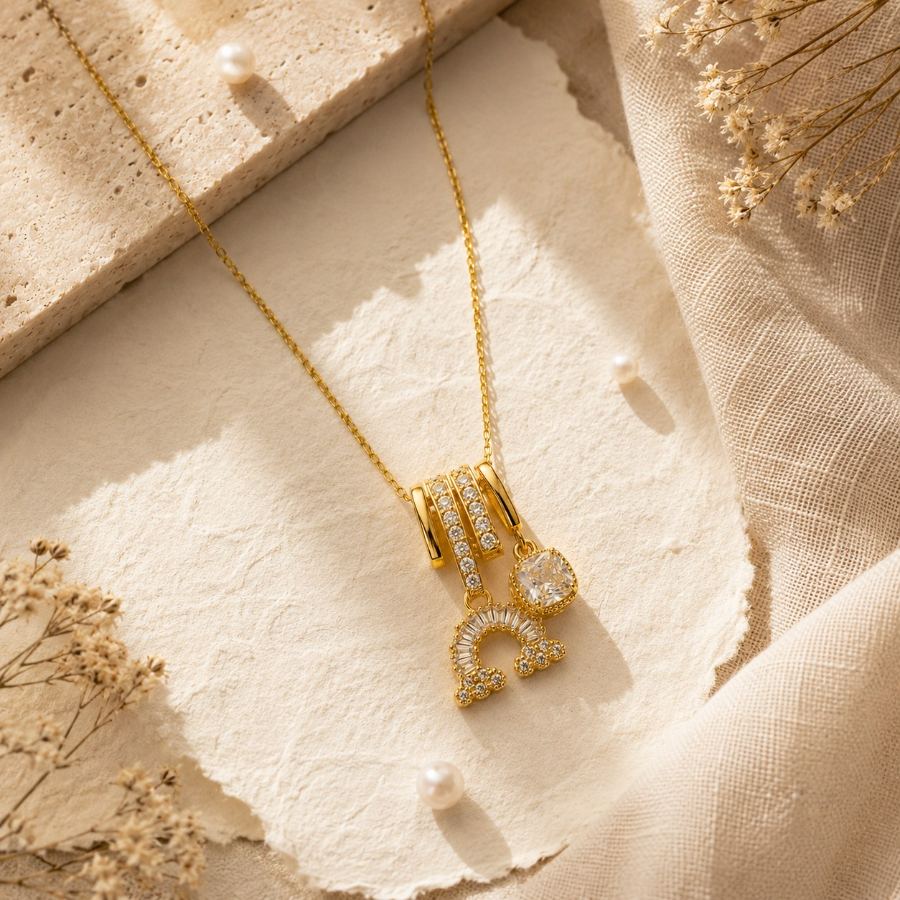extreme macro detail of Zircon stones and milgrain setting on gold charm necklace – House of Ruhira