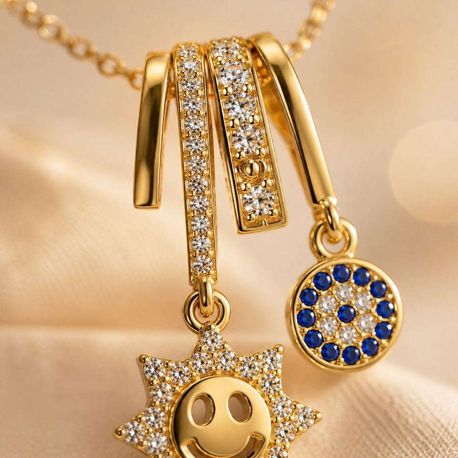 Flat lay styling of a gold charm necklace with sun and evil eye pendants, styled with a silk scarf and small diary – House of Ruhira