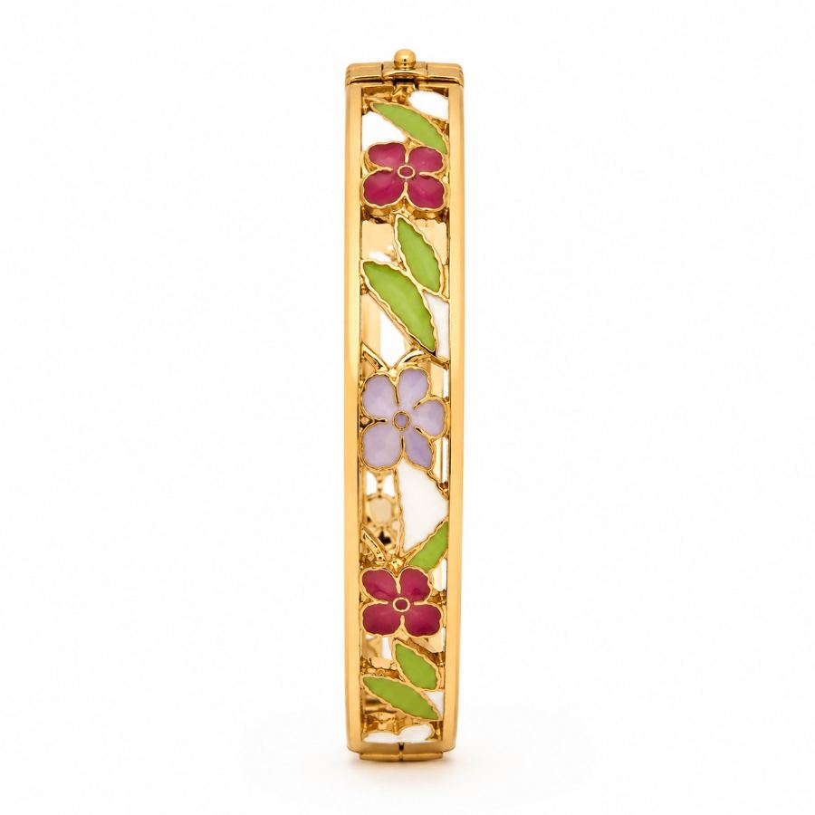 Flat lay styling of gold-plated enamel floral bangle with spring-themed props like silk scarf and fresh flowers — House of Ruhira